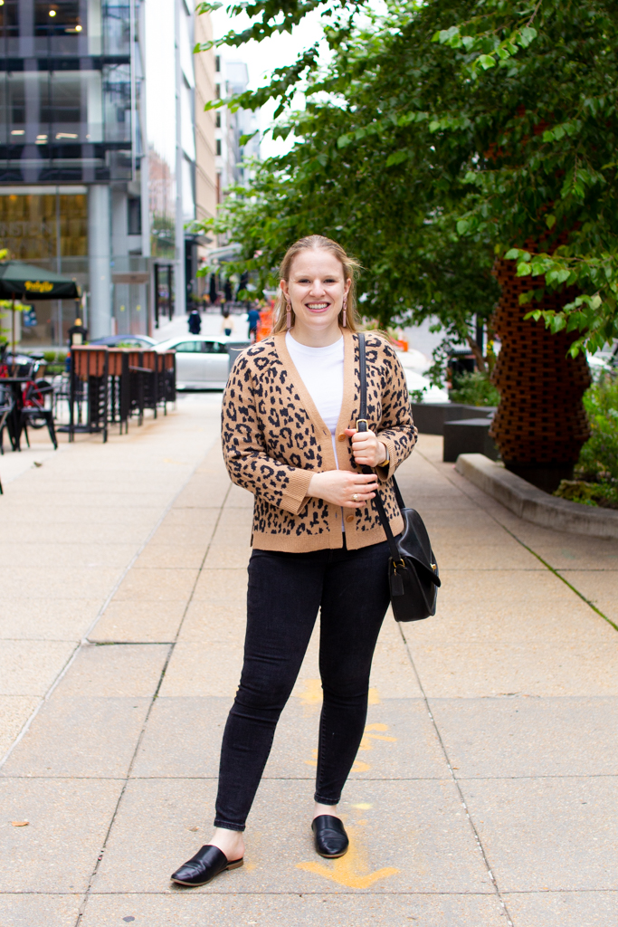 leopard print top over black jeans woman blogger wearing leopard print top over black jeans