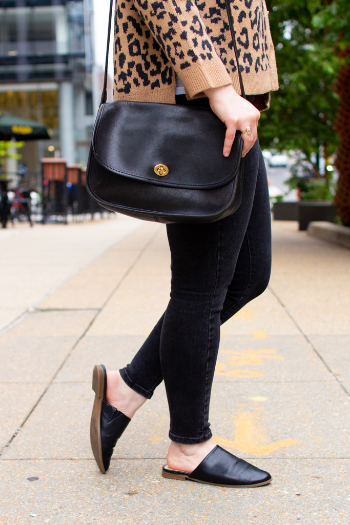 black jeans with coach bag woman blogger wearing black jeans with coach bag