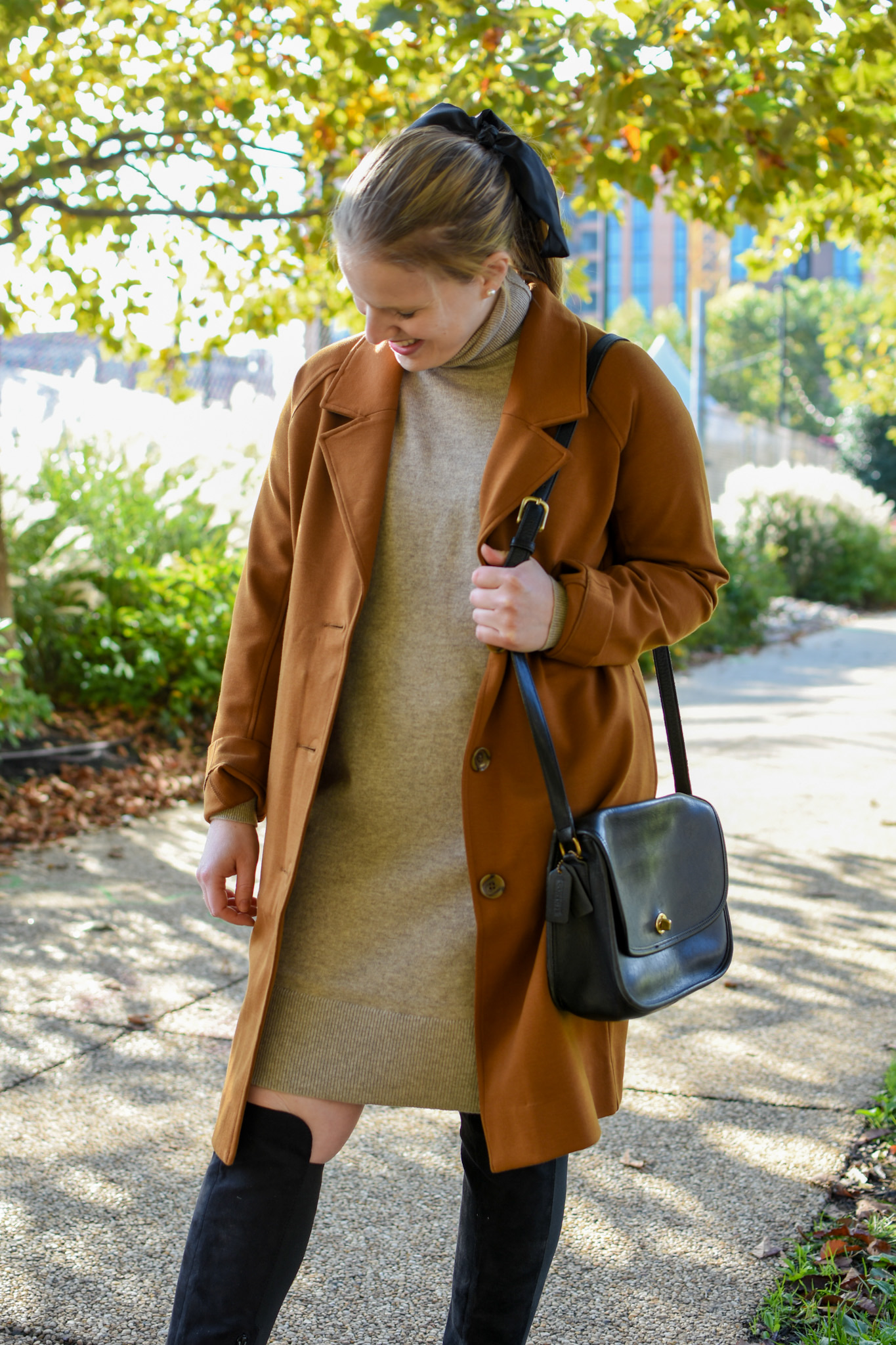 woman blogger wearing orange overcoat woman blogger wearing orange overcoat