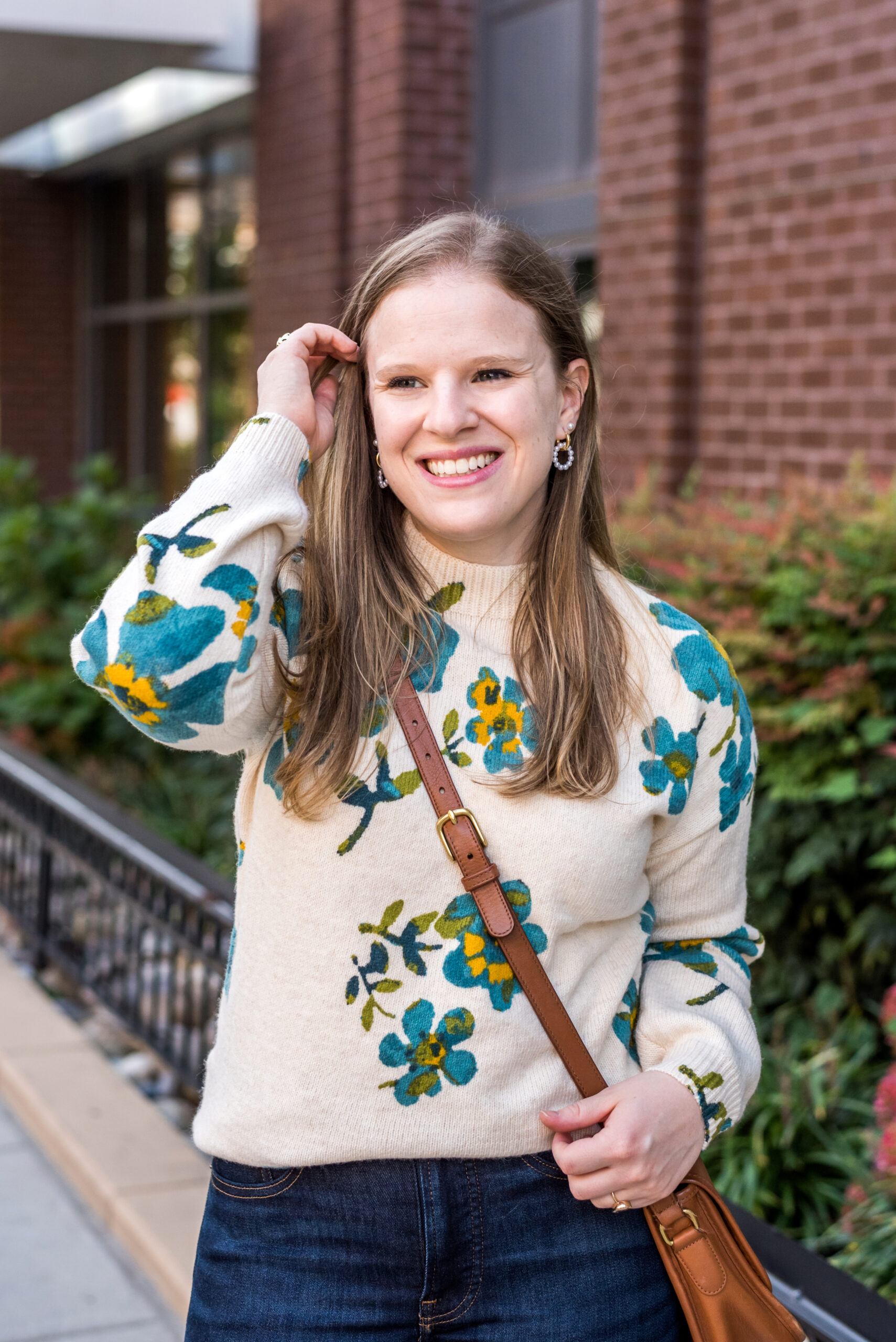 woman wearing loft floral sweater woman wearing loft floral sweater