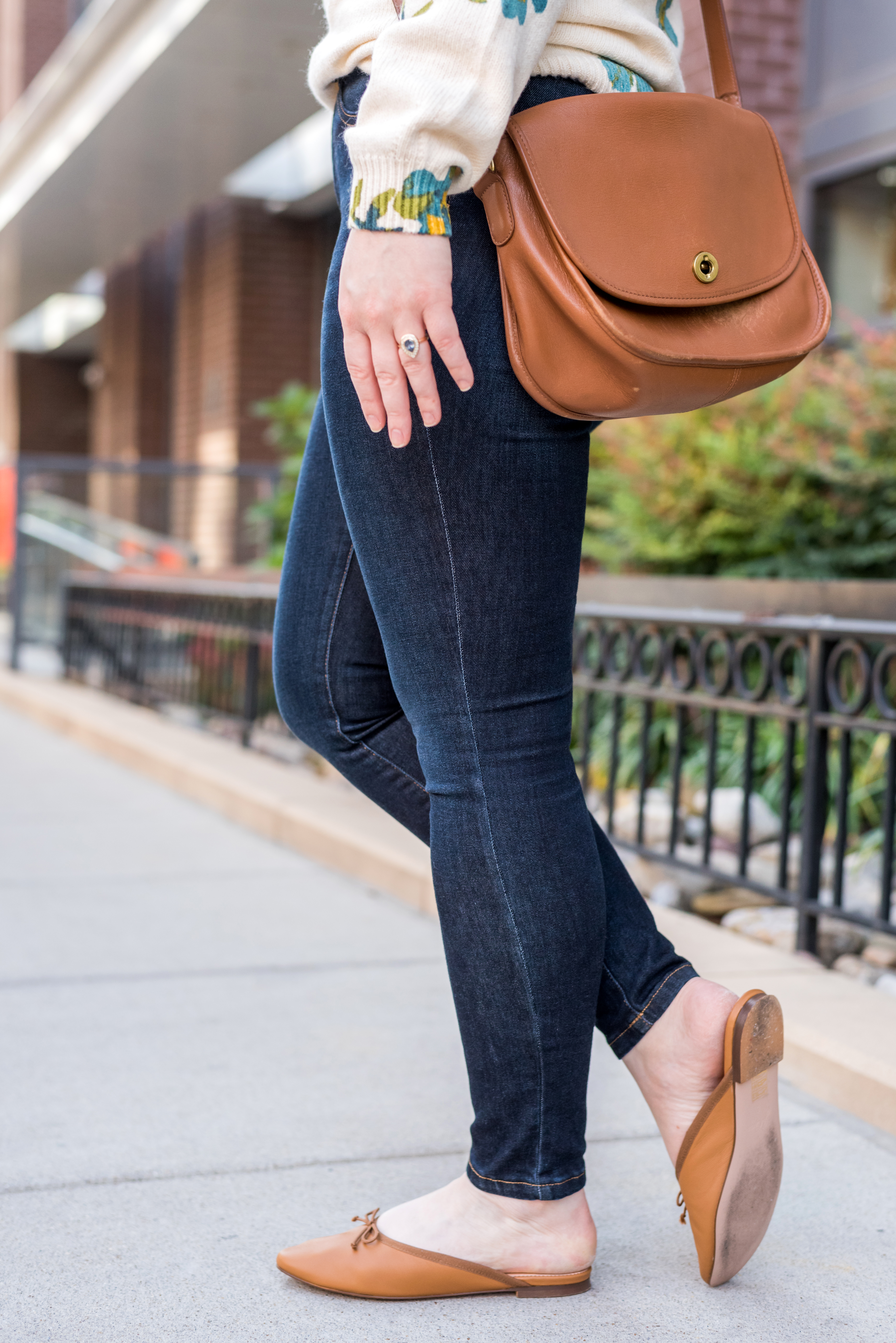 woman wearing madewell denim and j.crew mules woman wearing madewell denim and j.crew mules