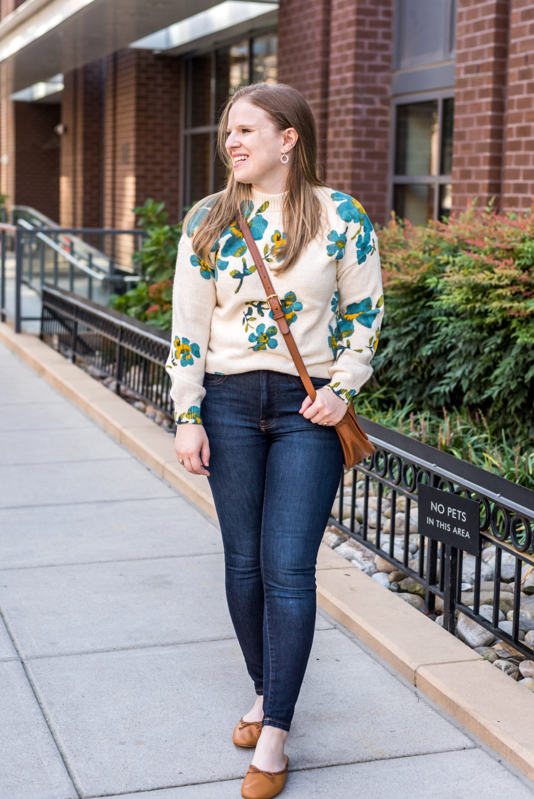 woman wearing loft mockneck floral sweater and jeans woman wearing loft mockneck floral sweater and jeans