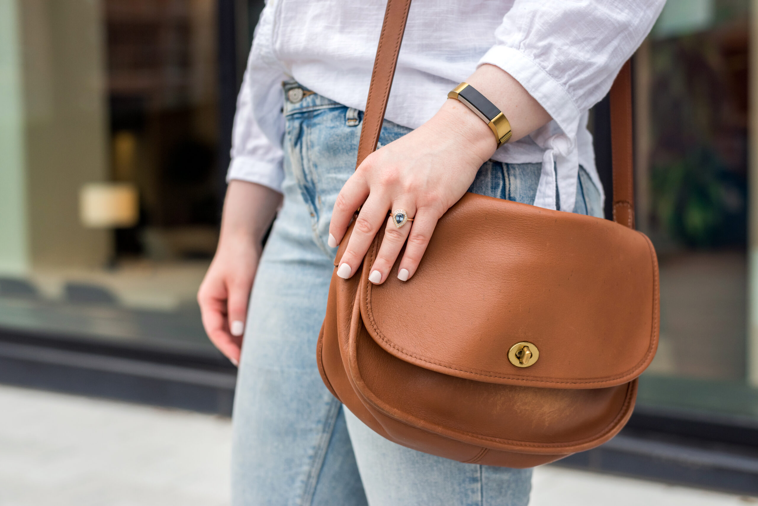 Woman carrying coach classic city bag Woman carrying coach classic city bag