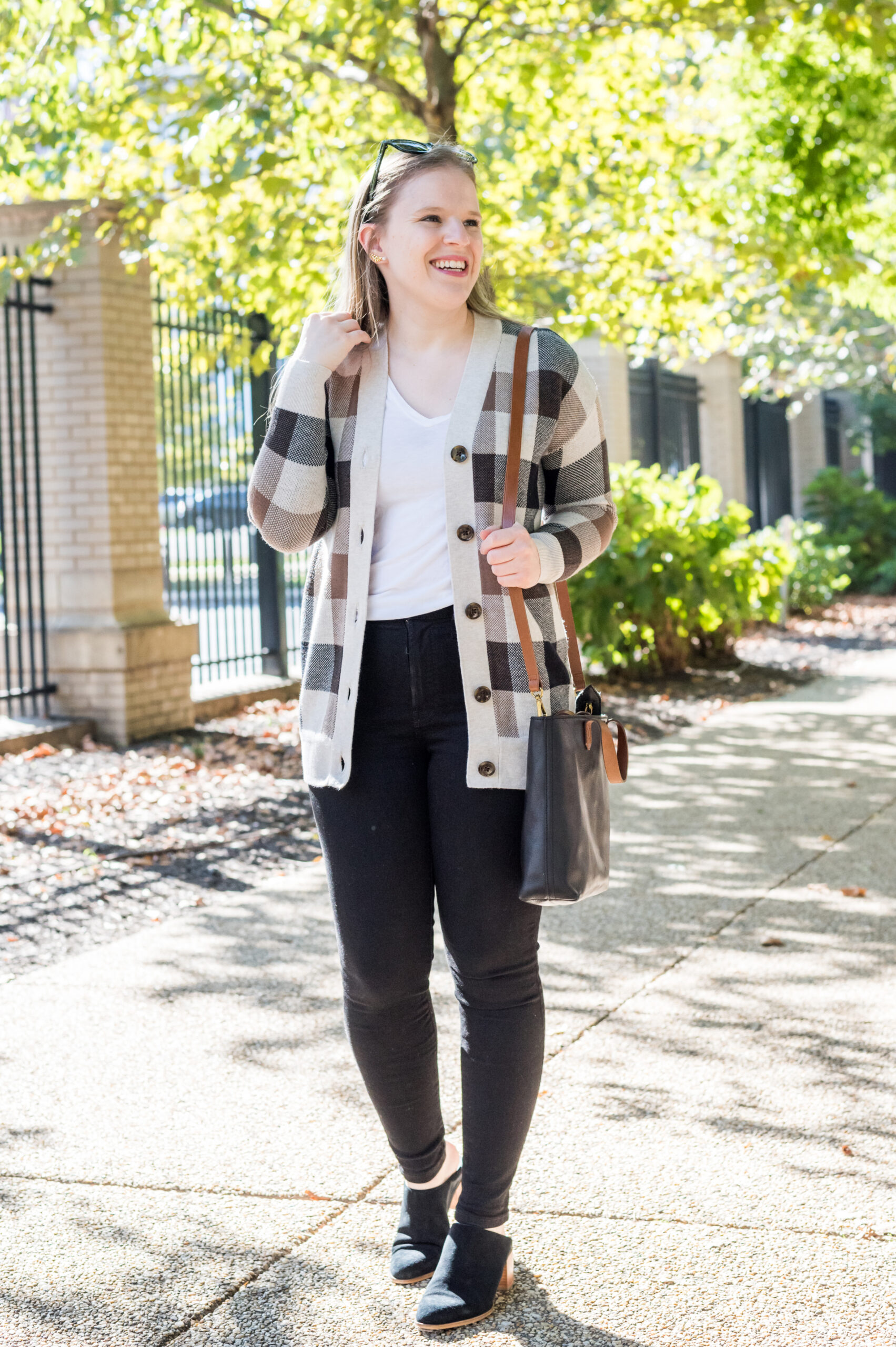 women wearing loft plaid cardigan, black jeans, and a mini bag women wearing loft plaid cardigan, black jeans, and a mini bag